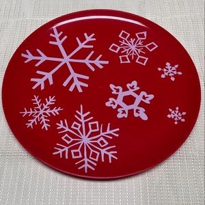 Red plastic serving tray with white snowflakes
